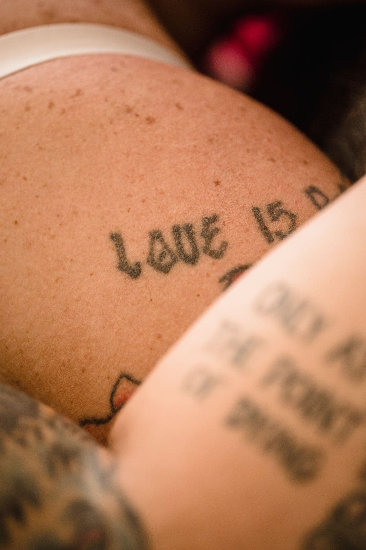 Script tattoo close-up on a shoulder
