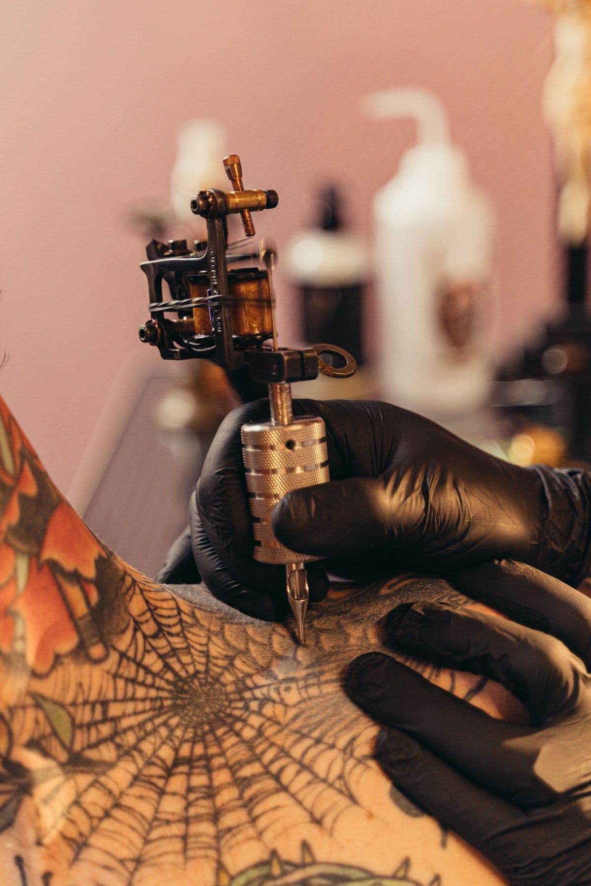 Spiderweb tattoo being inked on an elbow